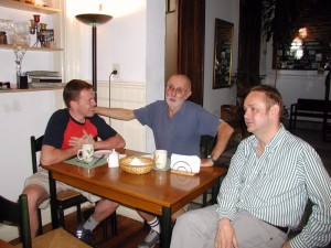 Friends Pascal, Nestor and Tuomas chat over breakfast.